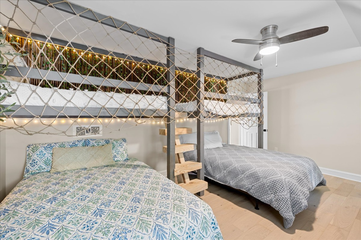 Bunk room with multiple beds